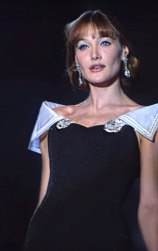 Christian Dior Boutique FW 1995 Runway Black Embellished Evening Gown — Runway reference showing the black gown with draped shoulder fabric