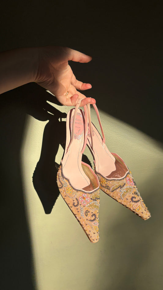 René Caovilla Pink Beaded Slingback Heels (41) — Pair of slingbacks held by their straps in sunlight