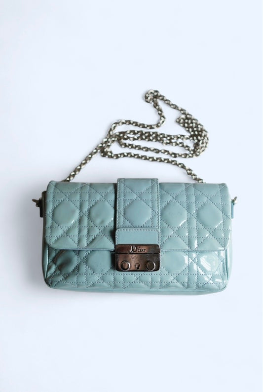 Vintage Dior Cannage Shoulder Bag — Front view of the blue quilted bag and chain strap