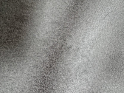Valentino Dove Grey Silk One-Shoulder Dress — Fabric condition detail showing a small mark