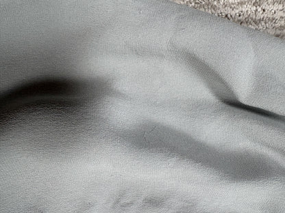 Valentino Dove Grey Silk One-Shoulder Dress — Close-up of grey fabric and seam