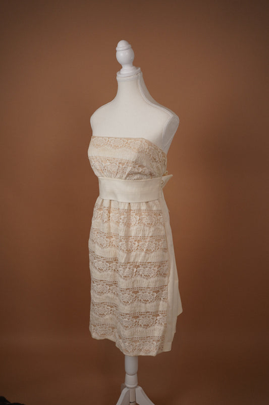 La Perla “Alice” Strapless Lace & Silk Bow Dress — Angled front view of the lace bodice and skirt