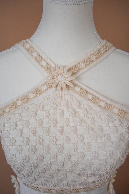 Moschino Cheap and Chic Ivory Floral Crochet Daisy Mini Dress — Close-up of the crossed neckline and daisy motif
