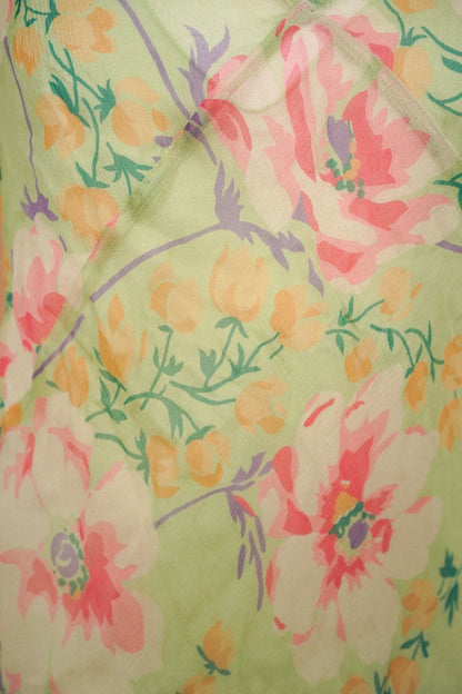 Pink, yellow and lavender floral print on pale green fabric
